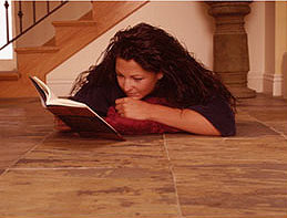 Woman on radiant heated tile floor.