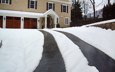 A driveway heating system installed in asphalt.