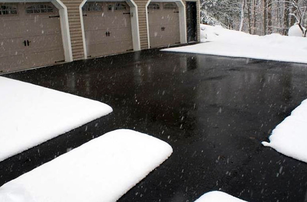 A radiant driveway heating system and heated walks after a snowstorm.