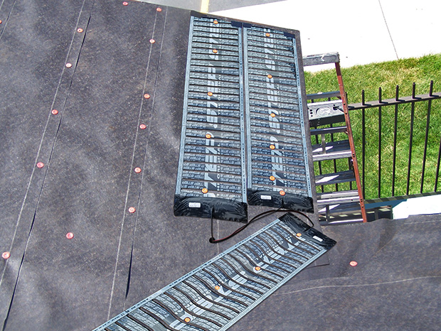 A low-voltage roof de-icing system installed to heat roof valley and eaves.