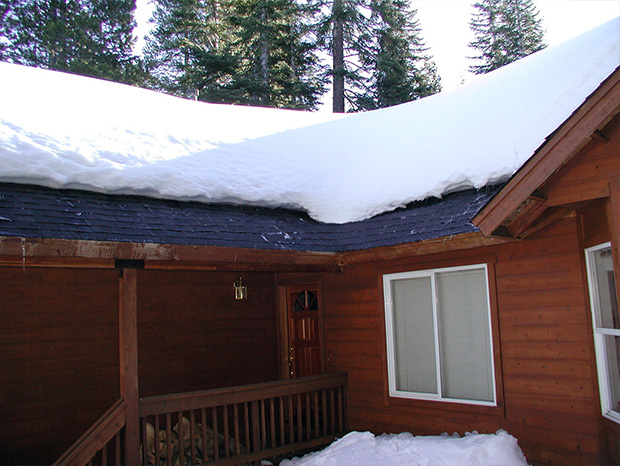 A roof de-icing system installed to heat roof eaves.